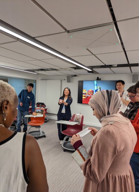 Workshop facilitators and participants standing in a circle