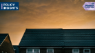 A photo of houses against a sunset backdrop