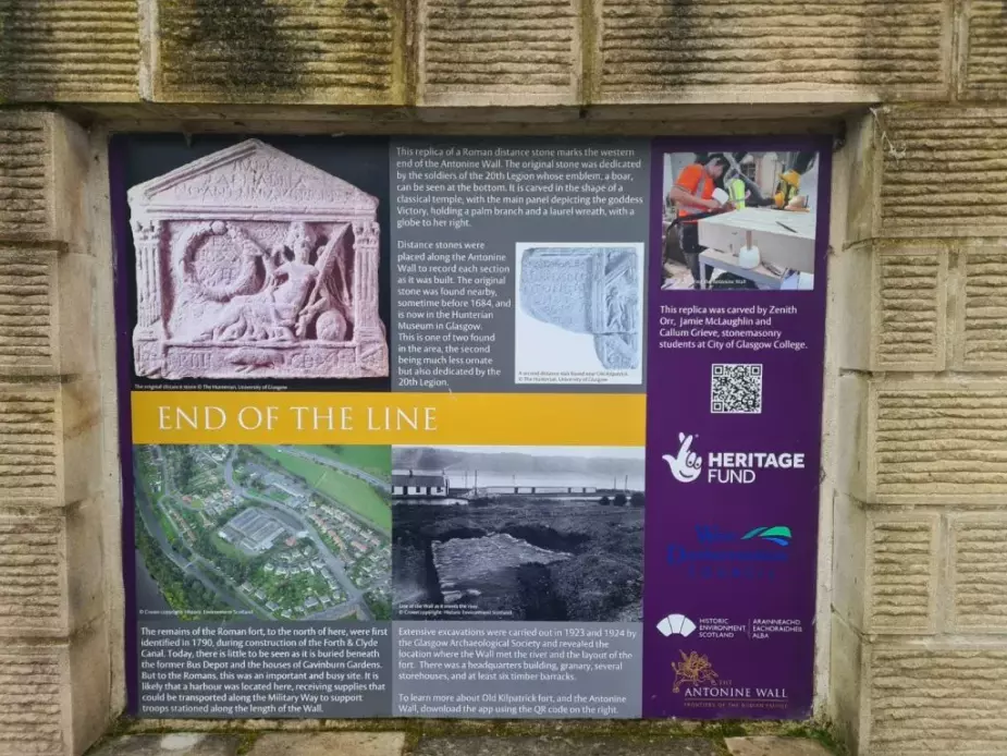 Antonine Wall 'End of the line' information sign mounted on sandstone wall