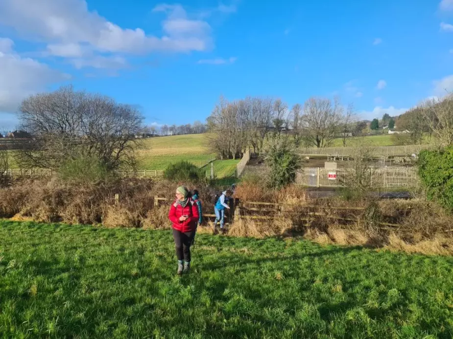 Alison Phipps, Bella Hoogeveen and Jennifer McArthur walking across a field