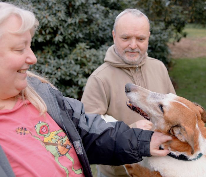 Levi the dog and his two owners