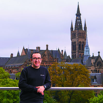 Mohammad Varchandi on the JMS balcony with the tower in the background