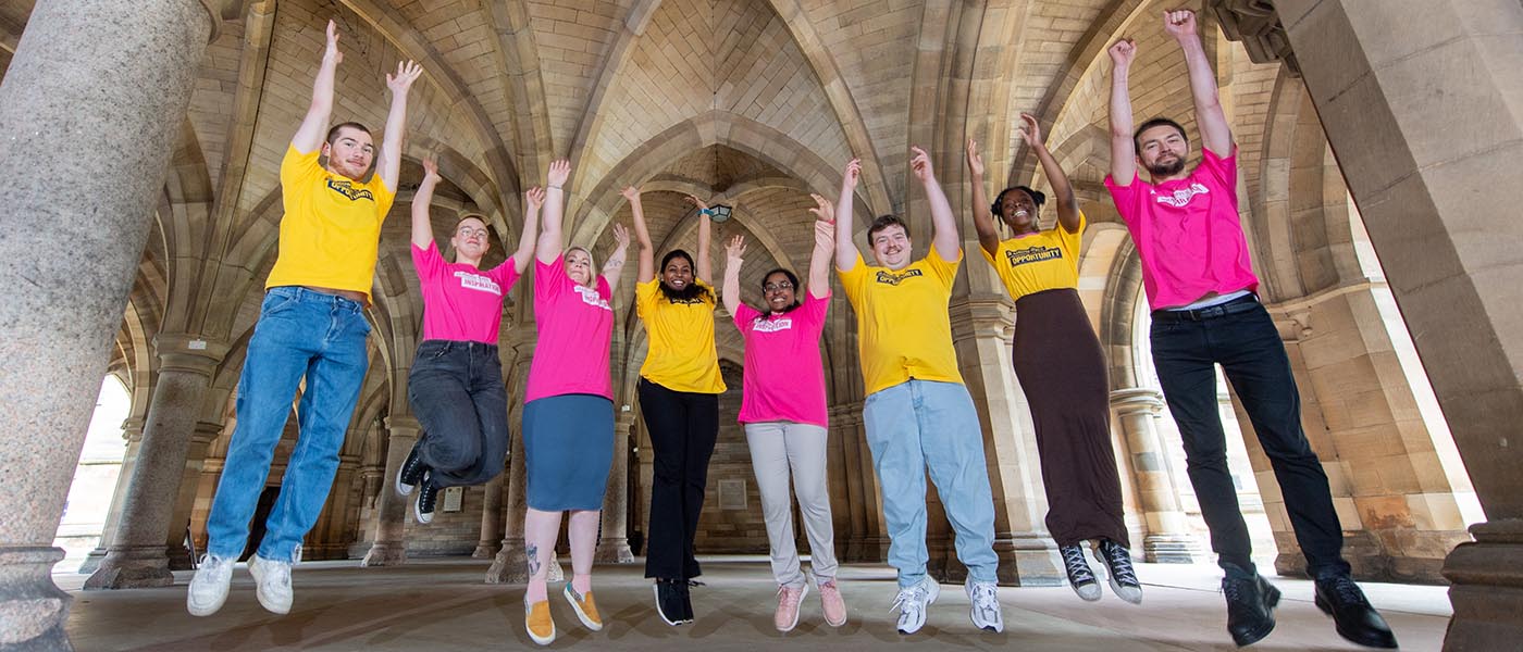 DAO staff jumping in the cloisters.