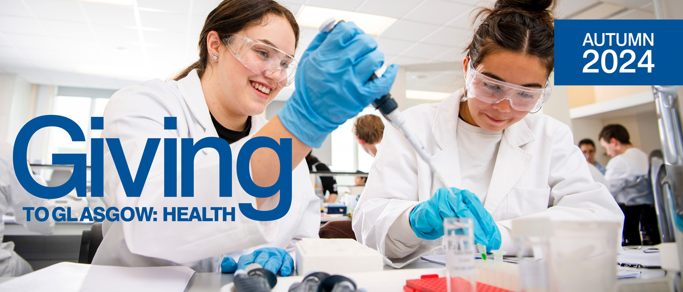 Students in a lab with the Giving to Glasgow: Health text overlaid