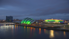 A photo of Glasgow across the Clyde at night