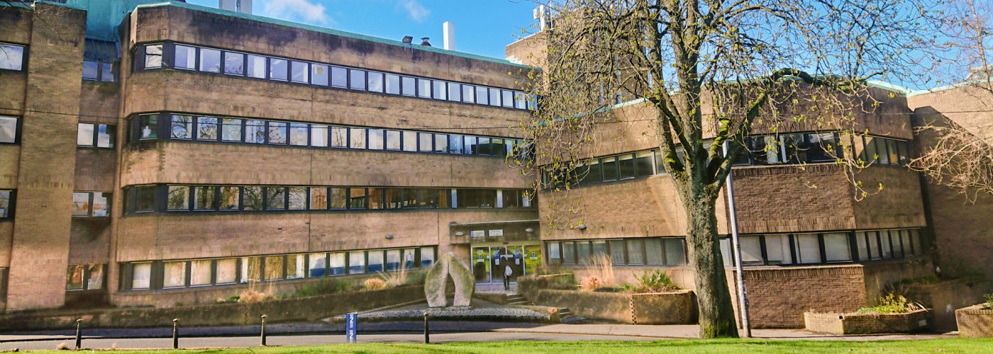 A photograph of the Molema Building taken on a sunny day with blue sky