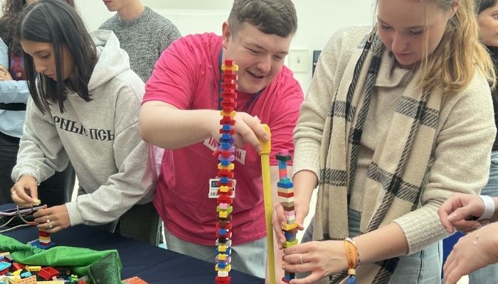 Students building a tower out of blocks