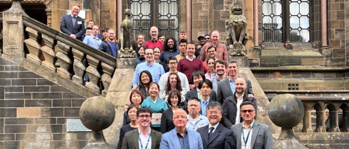 Glasgow and Tokyo delegates in a group photo on the Lion and Unicorn Staircase at the Gilmorehill campus