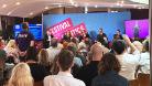 Picture of the panel with audience hand raised