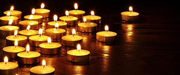 tea light candles on a black background