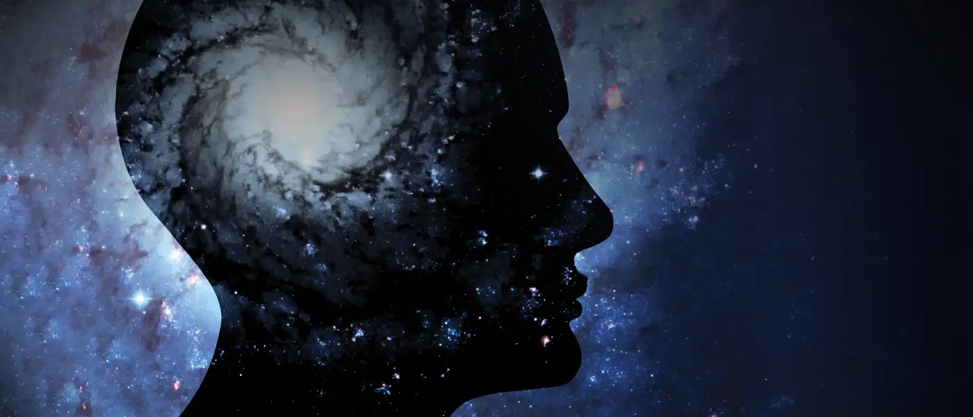 Conceptual image of a human head and the universe.
