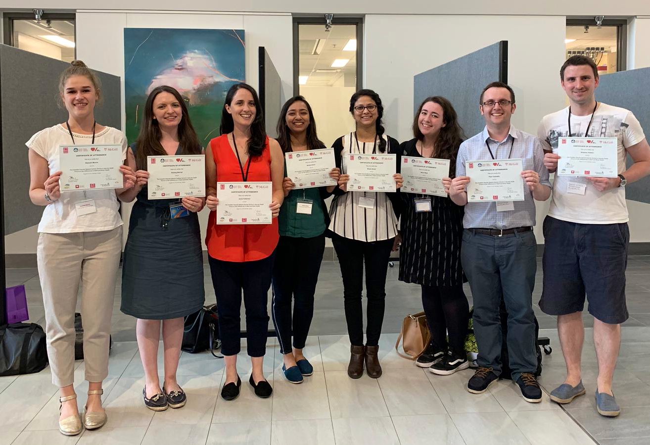 Image of a group of people with their certificates 