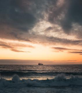 Boat in the distance on water