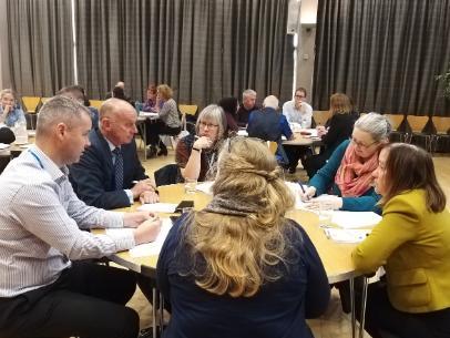 People sitting round table in discussion