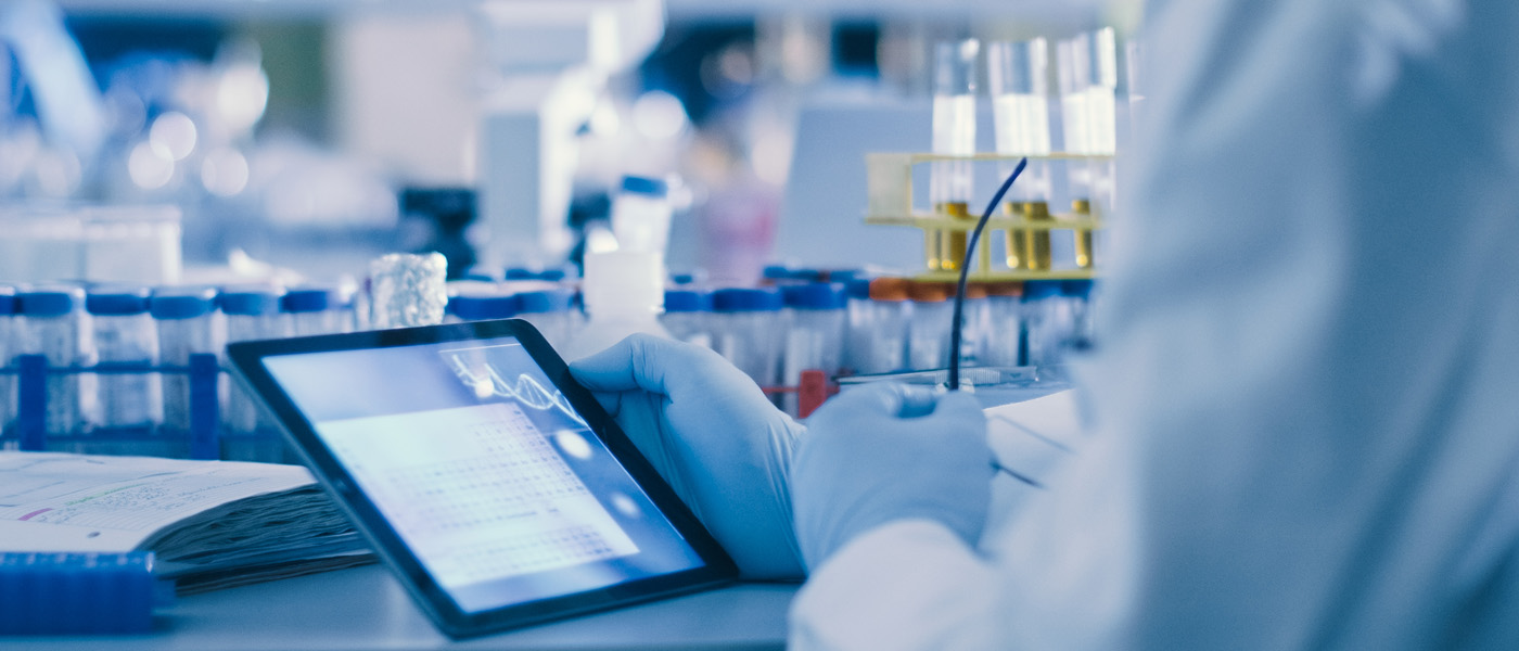 A biological researcher using a tablet computer