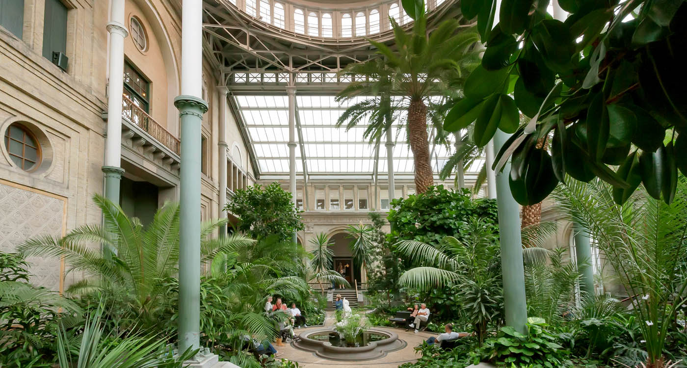 Winter Garden with glass domed roof inside the New Carlsberg Glyptotek Museum [Photo: Shutterstock]