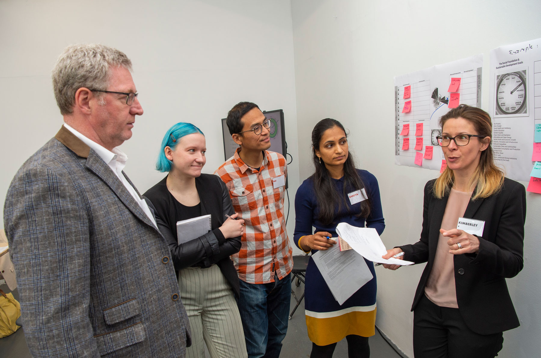 Four workshop participants engaging in a discussion