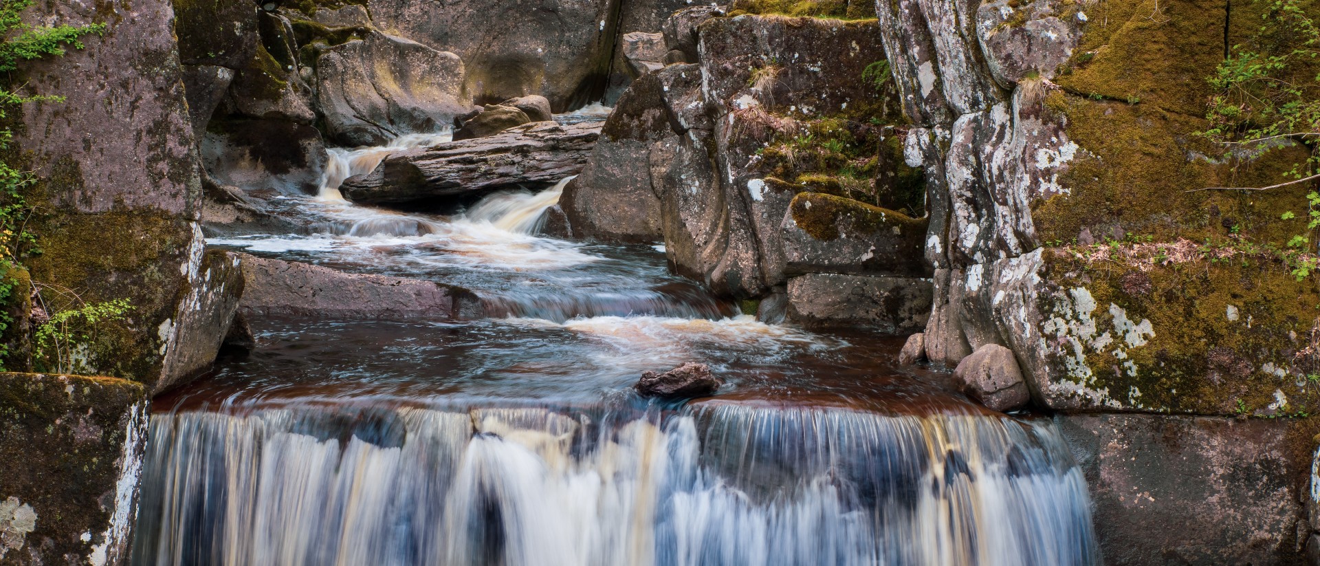 River waterfall between rocks