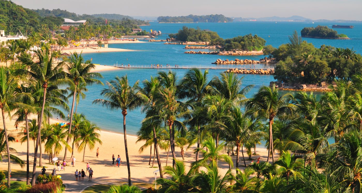 Sandy beach and palm trees on Sentosa island [Photo: Shutterstock]