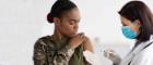 Woman holding up her sleeve and looking as a medic injects her Source: Prostock-Studio Publisher: Istockphoto Link: https://www.istockphoto.com/photo/military-vaccination-african-american-soldier-lady-getting-vaccine-shot-against-gm1369012914-438863714?clarity=false