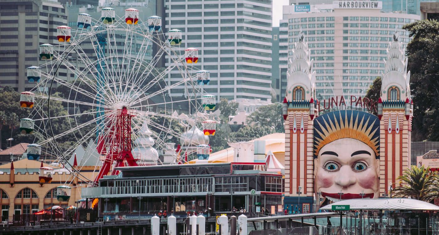 Luna Park rides with the city in the background [photo: Annie Spratt, Unsplash]