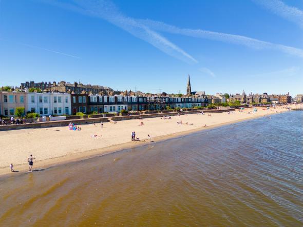 The beach at Leith in Edinburgh with blue skies and sunny weather