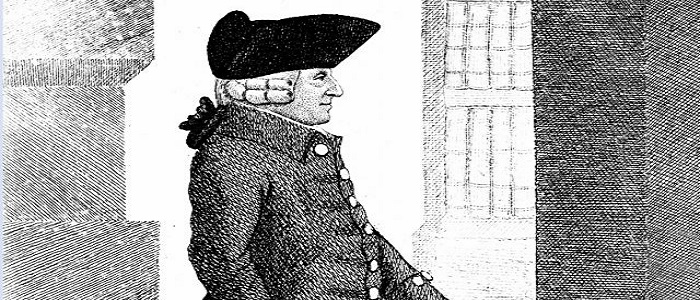 Adam Smith standing around columns in the background in black and white. Source: BBC Radio 4